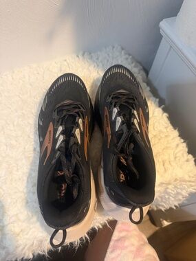 Brooks black sneakers with copper accents and white soles